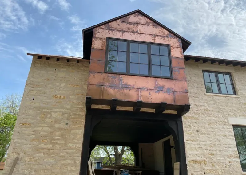 Copper metal panel facade on a stone building for Skylight Installation in Mokena